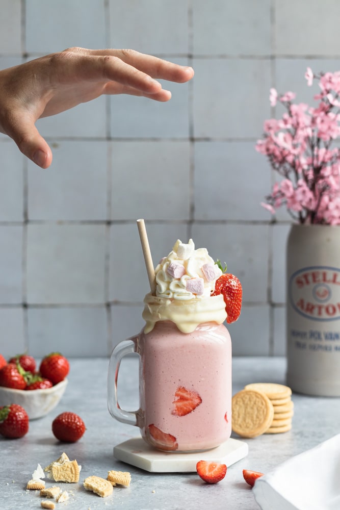 Oreo golden strawberry milkshake with whipped cream and marshmallows