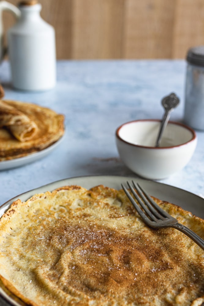 Plate with a Dutch Pancake with cinnamon and sugar