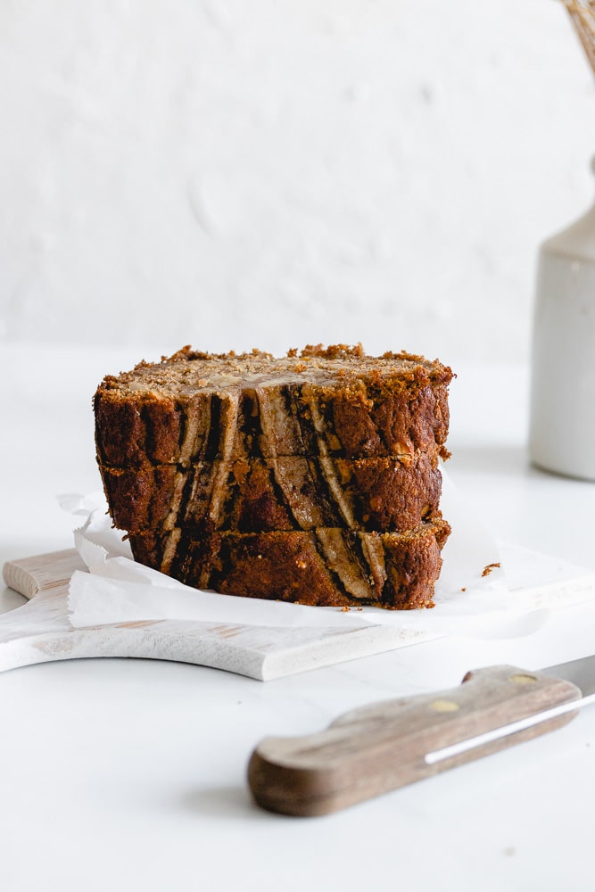 Stock of 3 pumpkin banana bread slices with white background