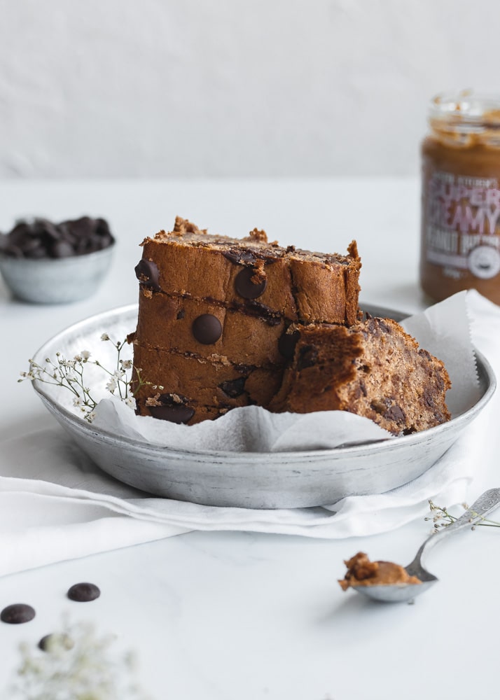 Stack of peanut butter banana bread on a white background