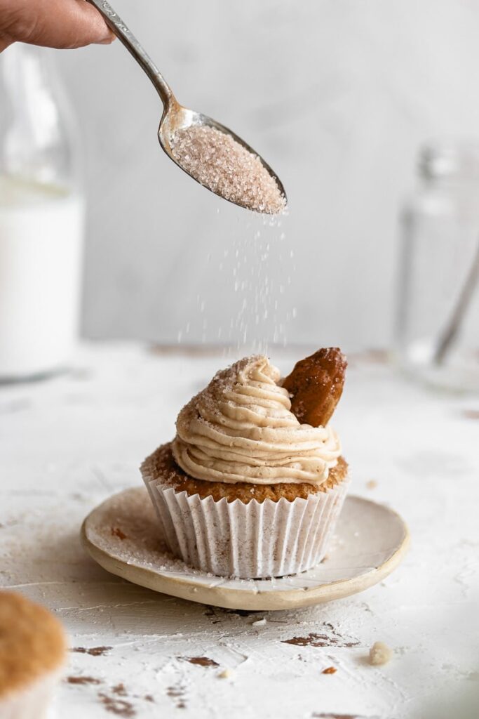 Churro cupcake sprinkled with cinnamon sugar