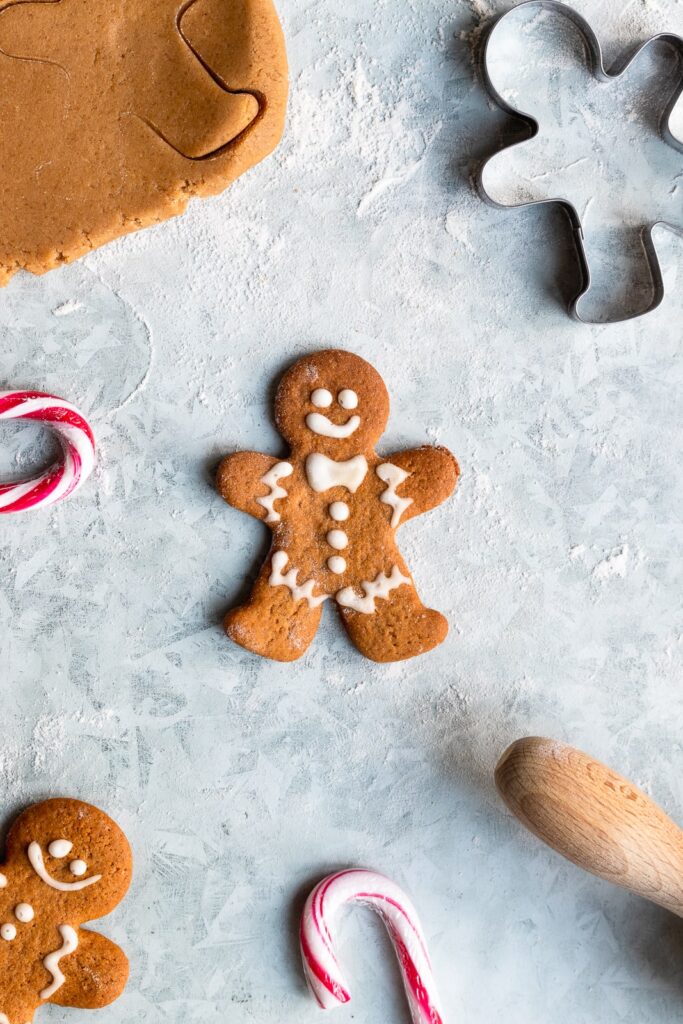 Gingerbreadman cookie flatlay with cookie dough and cutter
